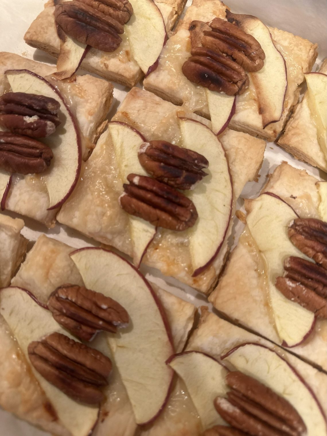 Close up photo of apple gruyere pecan tarts appetizer